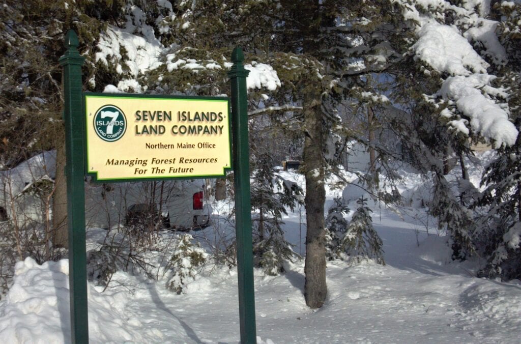 photo of seven islands land company northern maine office sign in winter