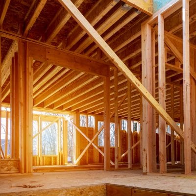 photo of building under construction showing wood beams and frames