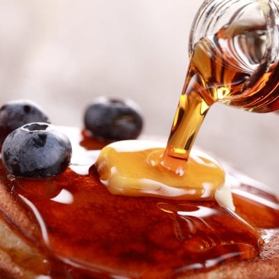 photo of Maple Syrup poured on pancakes